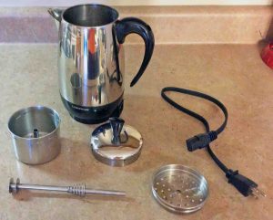 Picture of the Farberware FCP280 Electric Percolator, disassembled, showing all Its parts.
