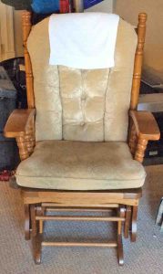 Picture of a Typical Wooden Glider Rocker with Cushions Well Used