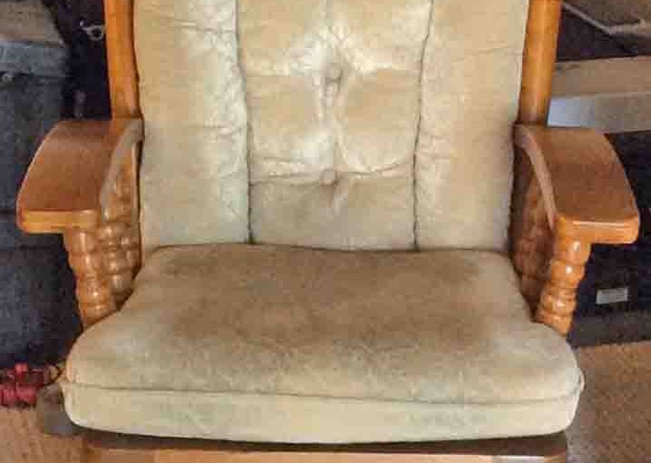 Picture of a Typical Wooden Glider Rocker with Cushions Well Used