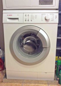 Picture of a Typical Apartment Size Front Loader Clothes Washer from Bosch. Top Load vs Front Load Washers.