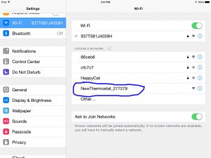 Screen shot from iPad Air, showing the Honeywell RTH8580WF Thermostat Created Wifi Network, circled in blue.