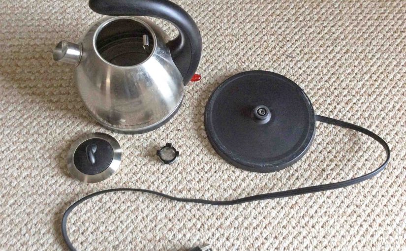 Picture of the Hamilton Beach 40891 Electric Kettle, Disassembled, showing the kettle, strainer, lid, and power stand.