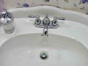 Picture of our bathroom sink, with the broken faucet replaced. How To Change Bathroom Sink Faucet.