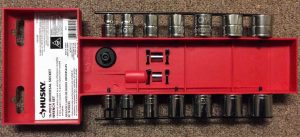 Pictre of the rear view of the 16 Piece Universal Socket Ratchet Set by Husky Tools in the included plastic holder keeper. 