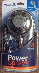 Picture of the Waterpik Power Spray Plus NSP-853 massaging shower head, front view, in package.