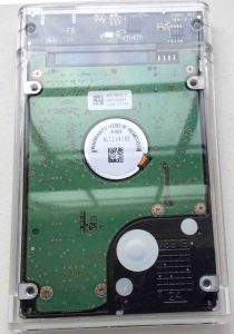 How to recover a hard drive that is clicking. Picture of a Samsung laptop disk drive in USB enclosure, bottom view.