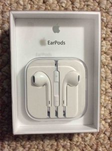 Picture of the Earpods in original packaging, front. Apple Earpods review.