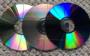 Picture of typical data CD, music CD, and DVD discs.