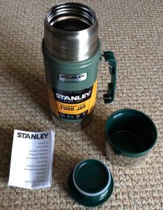 Picture of a disassembled 24 ounce Stanley Classic Vacuum Food Jar, that shows all included attachments. 