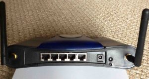 Picture of the back of the Bountiful WiFi BWRG1000 wireless router. Showing the WAN, LAN, power, and antenna ports. Also shows the reset button. How to fix WiFi router.