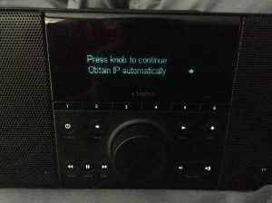 Picture of the Logitech Squeezebox Boom Radio, Displaying the Obtain IP Address Automatically Setting Screen.