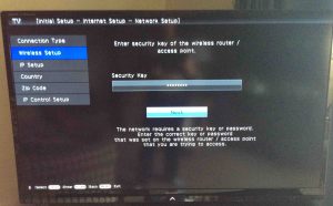 Picture of a Sharp smart TV, displaying the -Enter Security Key- screen, with the key field filled In.