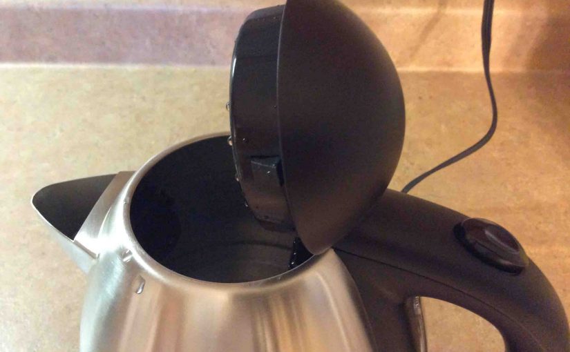 Picture of the Farberware 104556 Cordless Electric Kettle, showing the large mouth and attached hatch lid.