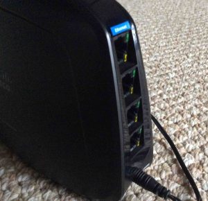 Picture of the slanted back panel Ethernet ports on the Cisco Linksys WES610N Wireless Network Bridge.