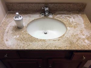 Picture of Lysol foam bathroom cleaner, applied to vanity sink. Note the foaming action. 