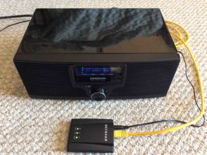 Picture of the adapter in action, feeding the Sangean WFR-20 Internet radio via its wired connection.