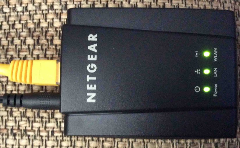 Picture of the Netgear WNCE2001 Universal Internet Adapter, top view, horizontal orientation.