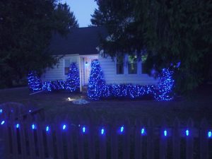 Picture of our LED Christmas lights outdoors, picket fence with C9 weatherproof LED lamps decorating it. Outdoor Christmas Light Decorating Ideas.