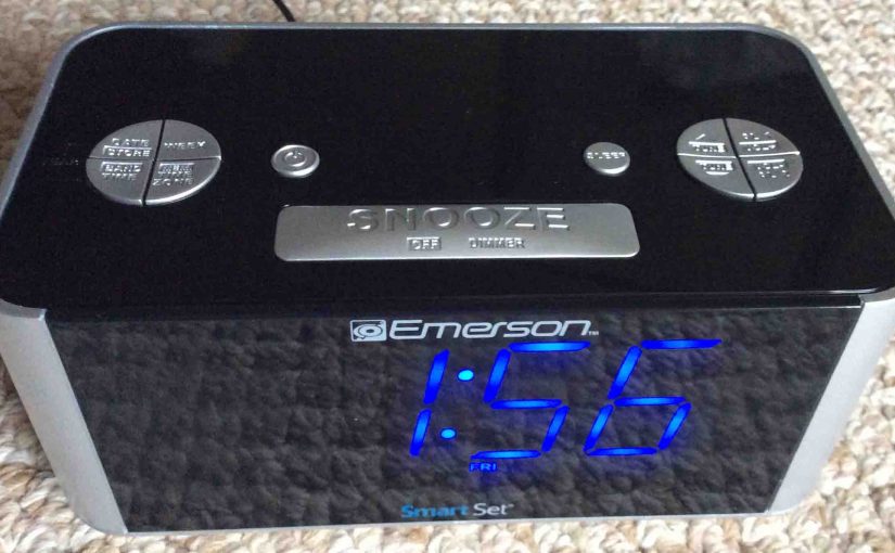 Picture of the Emerson CKS1708 SmartSet Clock Radio, top front view, showing blue LED display and the buttons.