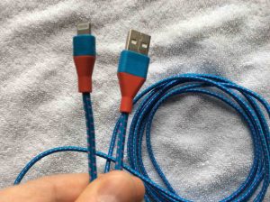 Picture of the iEdge® Lightning to USB Cable, 10 Foot, for iPhone, iPad, and iPod, E-330, Close Up View of Connectors, showing the integrated strain relief at both ends. 