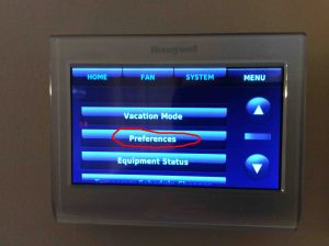 Picture of the thermostat, showing the Menu Screen with the -Preferences- button circled. Honeywell RTH9580WF thermostat reset.