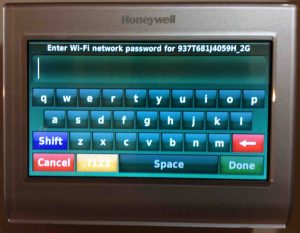 Picture of the Honeywell RTH9580WF smart t-stat , showing the WiFi Network Password Entry screen. 