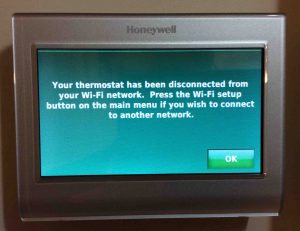 Change WiFi network on Honeywell thermostat RTH9580WF. Picture of the Honeywell RTH9580WF WiFi smart t-stat , displaying the Network Disconnected screen.