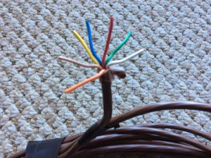 Picture of a typical seven conductor thermostat cable, showing the different colors of each wire within the cable. Honeywell Thermostat Wiring Color Code.