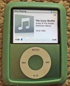 Picture of the iPod Nano 3rd Generation portable player, paused while playing an audio file.