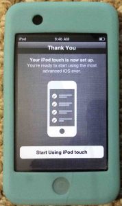 Picture of the Apple iPod Touch player, displaying the Setup Complete screen.