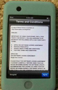 Picture of the Apple iPod Touch portable player, displaying the Terms and Conditions screen.