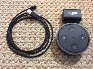Picture of the Amazon Alexa Echo Dot 2nd Gen with adapter and USB cable.