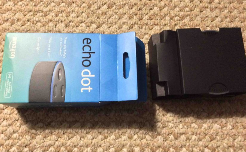 Picture of the Amazon Echo Dot 2nd Gen speaker, original package, with Inner spacer protector container pulled out.