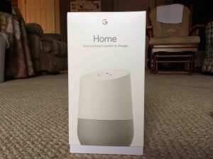 Picture of the Google Home, showing the front of the original packaging, closed, not yet opened.