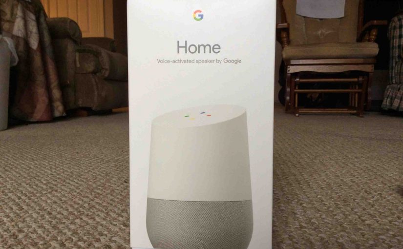Picture of the Google Home Voice Activated Speaker, showing the front of the original packaging, closed, not yet opened.