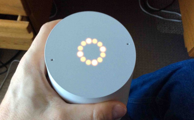 Picture of the Google Home smart speaker, about to reboot, showing the orange light ring, indicating that a reboot is imminant.