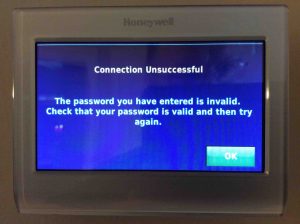 Picture of the Honeywell RTH9580WF Smart Thermostat, displaying the Connection Unsuccessful screen, due to an incorrect network password. 
