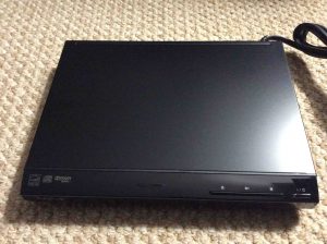 Picture of the Sony DVP-SR210P DVD player, unpacked, top view.