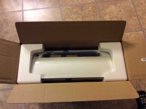 Picture of the printer in box, with open box top. Unboxing HP DeskJet 3632.