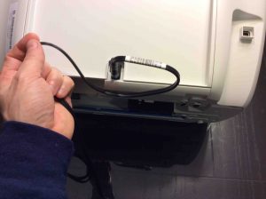 Picture of the HP DeskJet 3632 printer, rear view, showing power cord connected.