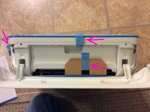 Picture of the printer with front panel open, and blue tape highlighted. Unboxing HP DeskJet 3632.