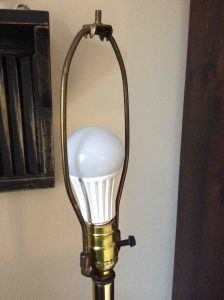 Picture of an LED light bulb in typical household lamp fixture, unlit.