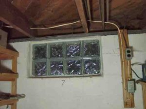 How to install glass block windows. Picture of the binside view of the asement glass block window replacement 7, mortar applied and shims removed, installation done. 