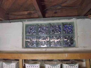 Picture of the Basement glass block window replacement 8, shims removed, installation complete, inside view.