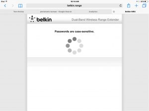 Picture of the Belkin F9K1122v1 Wi-Fi range extender in setup mode, displaying the -Checking Wireless Network Password- screen.