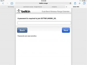 Picture of the Belkin F9K1122v1 Wi-Fi range extender in setup mode, displaying the 2.4 Ghz. network password prompt screen.