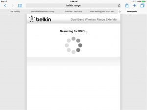Picture of the Belkin F9K1122v1 Wi-Fi range extender, displaying the -Scanning for Wireless Networks to Extend- screen. 