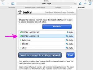 Picture of the Belkin F9K1122v1 Wi-Fi range extender in Setup mode, displaying the -Select Wireless Network to Extend- screen, with the 2.4 Ghz. network selected.