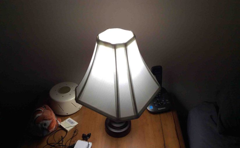 Picture of the Cree™ 60w LED daylight 5000k dimmable A19 light bulb, operating in bedroom lamp.
