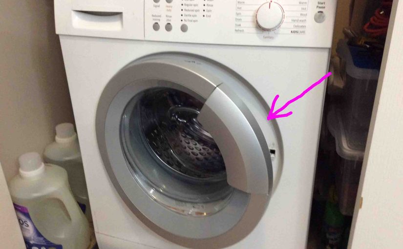 Picture of a typical front loader washing machine, with its door slightly open, to minimize mold and mildew growth on the rubber seal.